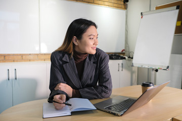 Businesswoman working at the computer in the workplace.
