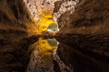 Cuevas de los Verdes, Lanzarote, Spain. Water in a cave, so still, it seems like you can climb down to another level.