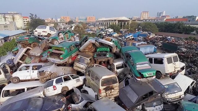 GUANGZHOU, CHINA. Hundreds of thousands of vehicles piled high, including motorcycles, scooters, trucks and cars.