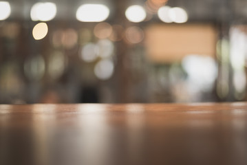wooden table on light bokeh background in the restaurant