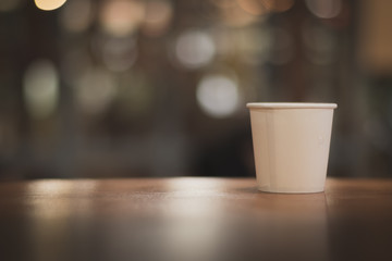 wooden table on light bokeh background in the restaurant