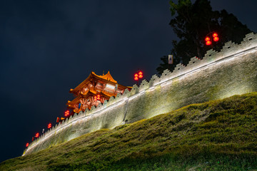 Night view of the Zhaoqing Ancient City Wall with Pi Yun Lou building