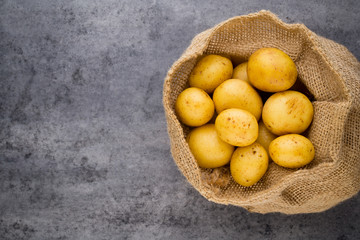 A bio russet potato wooden vintage background.