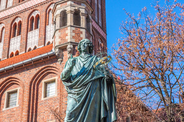 Fototapeta premium Famous statue of astronomer a (Mikolaj Kopernik) in Torun. Poland