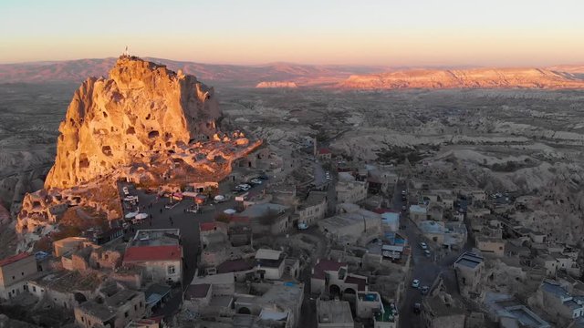 Aerial view to U&ccedil;hisar castle and the city, during sunset, Cappadocia, Turkey