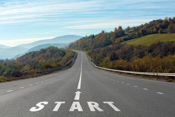 Landscape with asphalt road leading to mountains