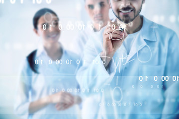 Medical students writing chemical formula on virtual screen in laboratory