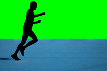 Fototapeta na wymiar Fast marathon runner silhouette with green background