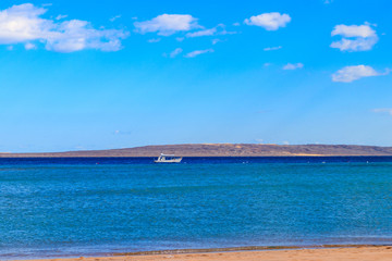 Fototapeta na wymiar White motorboat sailing in the Red sea, Egypt