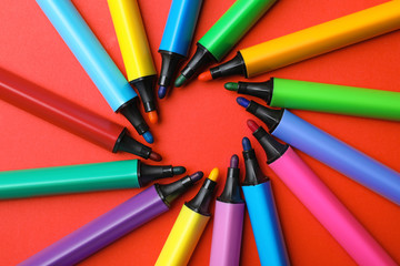 Flat lay composition with markers and space for text on color background. Rainbow palette