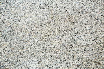 Stone wall rough gray granite texture background