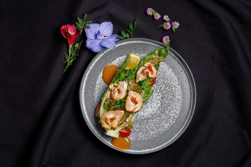 Roasted salmon on Romano with nut sauce and red caviar.