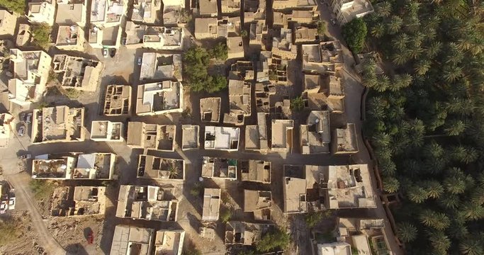 Top aerial view of honey-coloured stone houses in the ancient village. A typical and common village view and landscape of North Africa and Middle East.