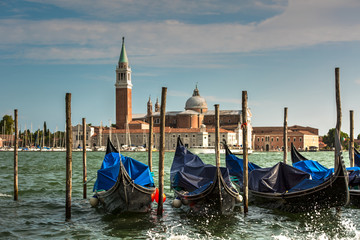 Fototapeta na wymiar Romantic Venice gondolas parking on grand canal