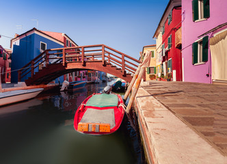 Fototapeta na wymiar colorful houses and bridge in Burano island