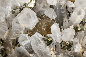 Macro stone Pyrite mineral in rock on a black