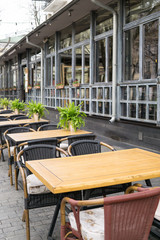 Empty tables in street cafe, chairs in street reastaurant