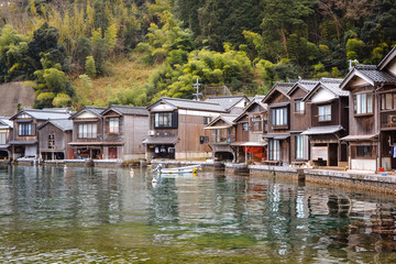 Fototapeta na wymiar Ine Cho and Funaya house or fisherman houseboat in Ine Bay in Spring season, Kyoto, Japan.
