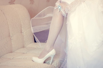 garter at the foot of the bride