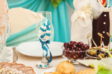 beautiful champagne glass decorated with blue flowers.