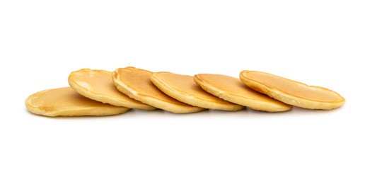 Row of fresh pancakes on white.