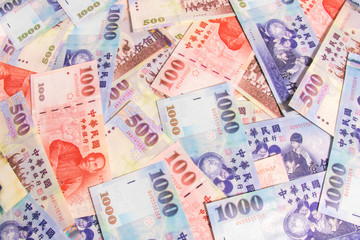 Fototapeta na wymiar Background of New Taiwan Dollar 1000, 500 and 100, Spread of Taiwan note.