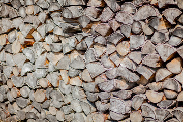 Firewood background, wall firewood, background of dry chopped firewood logs in a pile