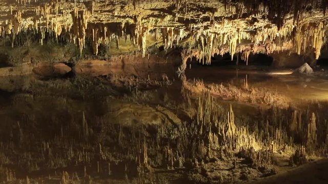 LURAY CAVERNS, VIRGINIA, USA. The cavern system adorned with speleothems reflecting in water.