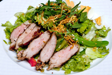 Tasty satat. Ingredients mixed salad, mini potatoes, asparagus, egg, bulgarian pepper, pork cut, mustard filling