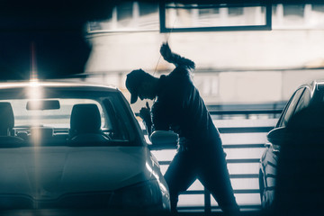 Bandit breaking car door