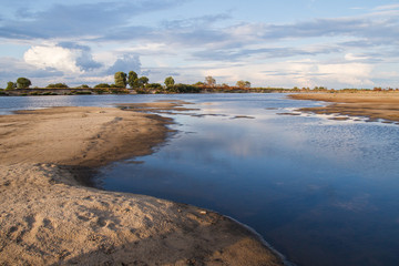 shallow river reflection of the sky