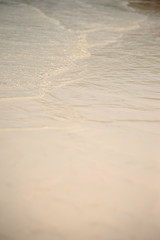 Small waves lapped the beach