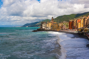 Fototapeta na wymiar View of Camogli with its stormy sea in the Ligurian Riviera in Italy.