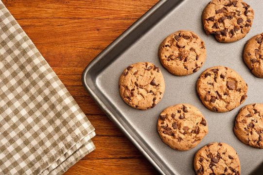 home made chocolate chips oat cookies  in a baking pan in rustic style 