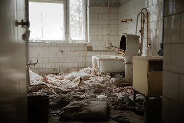 Old laundry room of abandoned hospital