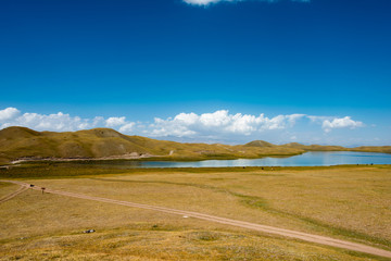 Osh, Kyrgyzstan - Aug 19 2018: Tulpar Kol Lake in Alay Valley, Osh, Kyrgyzstan.