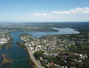 Aerial view of Narrabeen Lake. Sydney CBD in the background.