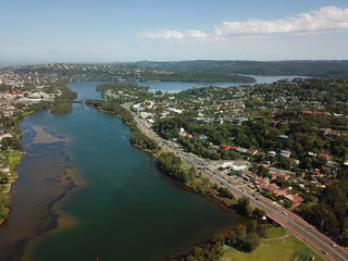 Fototapeta na wymiar Aerial view of Narrabeen Lake. Sydney CBD in the background.