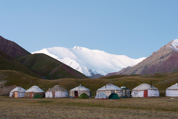 Osh, Kyrgyzstan - Aug 20 2018: Morning Sunlight Landscape of Lenin Peak (7134m) at Tourist Yurt...
