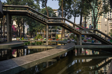 People walking in Turtle Park square in central Saigon. Ho Chi Minh, Vietnam
