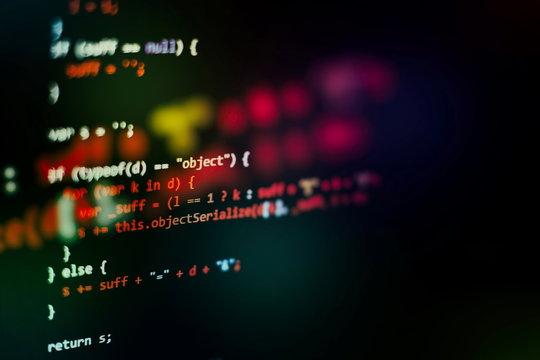 HTML5 in editor for website development. Website HTML Code on the Laptop Display Closeup Photo.