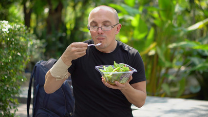Happy Smiling University Student Eating Healthy Salad During Lunch Break on Campus