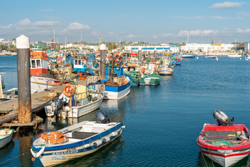 Fototapeta na wymiar The fishing port of Lagos. Berth for cutter, trawler and commercial fishing of seafood