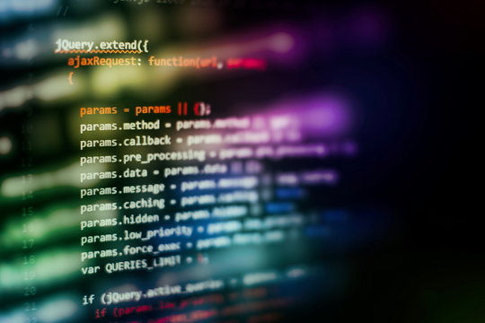 HTML5 in editor for website development. Website HTML Code on the Laptop Display Closeup Photo.