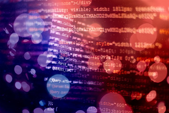 HTML5 in editor for website development. Website HTML Code on the Laptop Display Closeup Photo.
