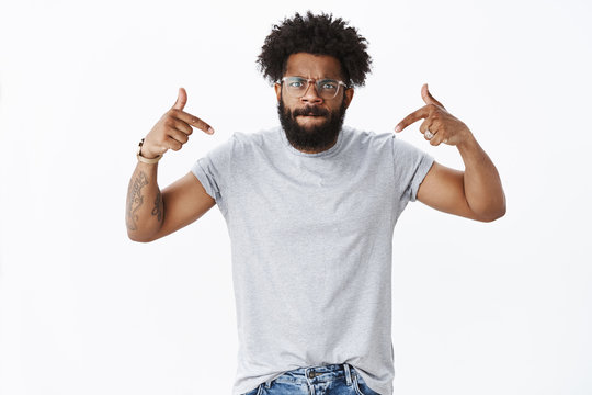 Guy being pissed wife wasting all money he earned losing temper, looking angry and outraged sucking lips, frowning pointing at himself as arguing, standing freaked-out over white background
