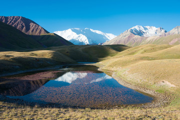 Osh, Kyrgyzstan - Aug 20 2018: Morning Landscape of Lenin Peak (7134m) at Alay Valley in Osh, Kyrgyzstan. Pamir mountains in Kyrgyzstan.