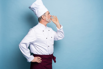 Chef, cook making tasty delicious gesture by kissing fingers. Confident bearded male chef in white...
