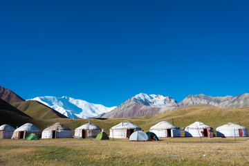 Osh, Kyrgyzstan - Aug 20 2018: Morning Landscape of Lenin Peak (7134m) at Tourist Yurt camp of...