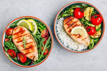 Grilled salmon steak with fresh and baked vegetables and rice
